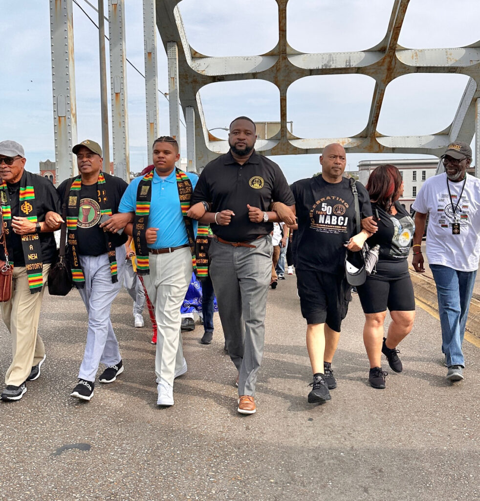 Leading March across the Edmund Pettus Bridge at the National Association of Blacks in Criminal Justice 50th Anniversary Conference.